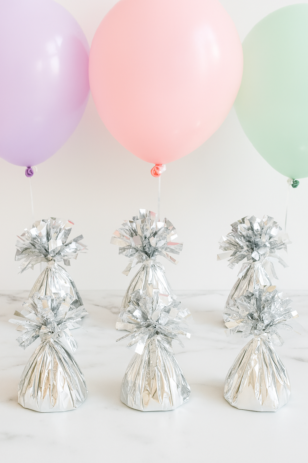 סט 6 משקולות בלונים כסופות – מושלם לאירועים נוצצים